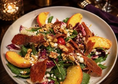 Sald with Peaches, walnuts, goat cheese & prosciutto